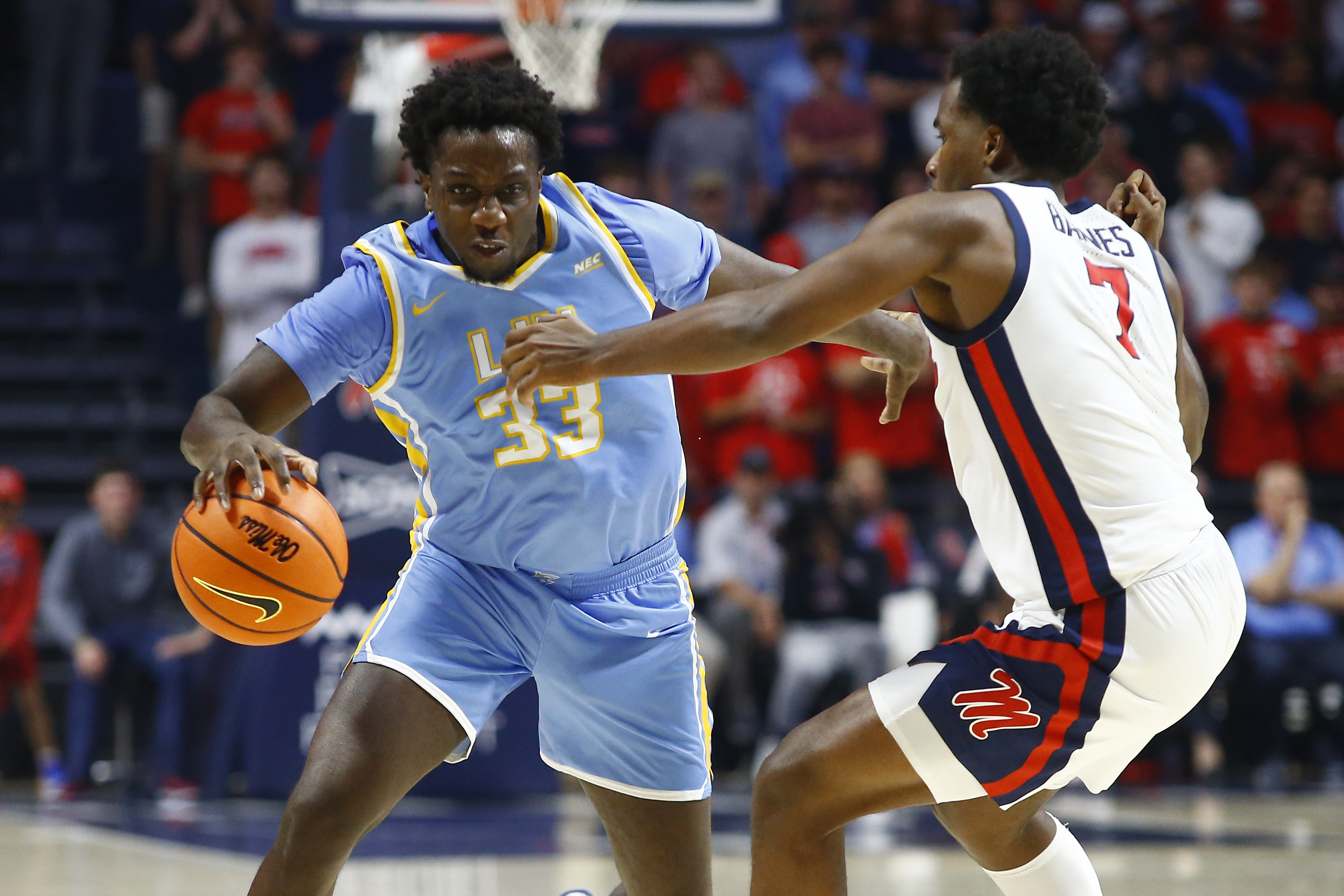 Long Island Sharks forward Jamal Fuller (33) drives to the basket as we break down our Mercyhurst vs. LIU prediction tonight.