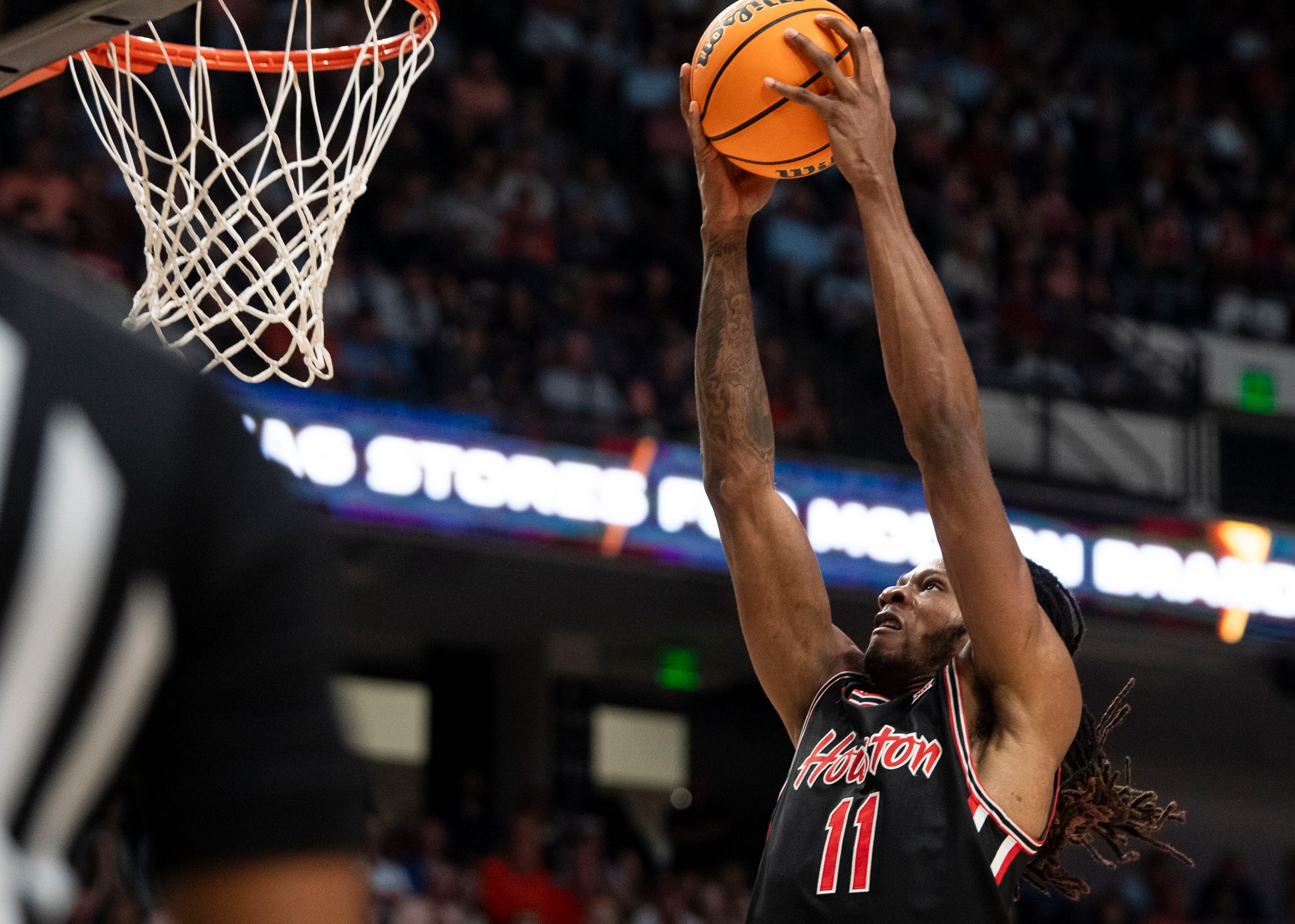 Houston Cougars forward Joseph Tugler (11) dunks the ball as part of our Tennessee vs. Houston prediction.