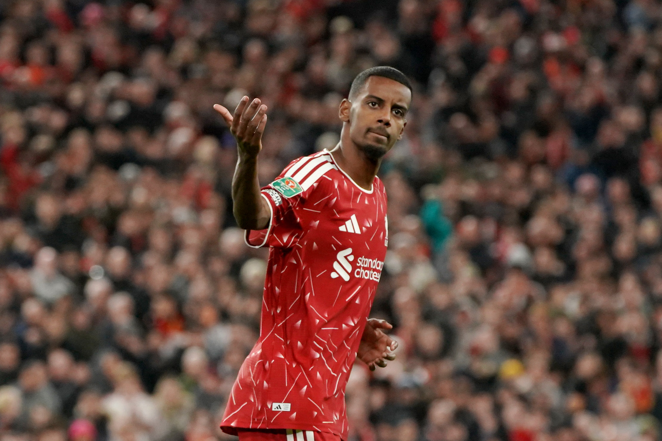 Liverpool's Alexander Isak celebrates scoring as we make our best Liverpool vs. Arsenal prediction.