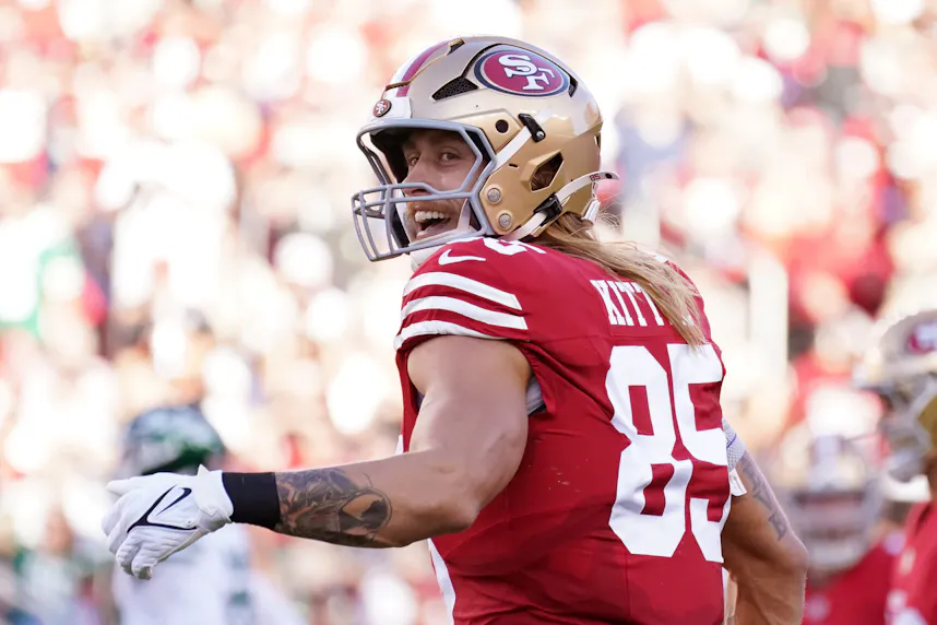 San Francisco 49ers tight end George Kittle smiles at the referee in the first quarter versus the New York Jets as we look at our first touchdown scorer predictions for Thursday Night Football.