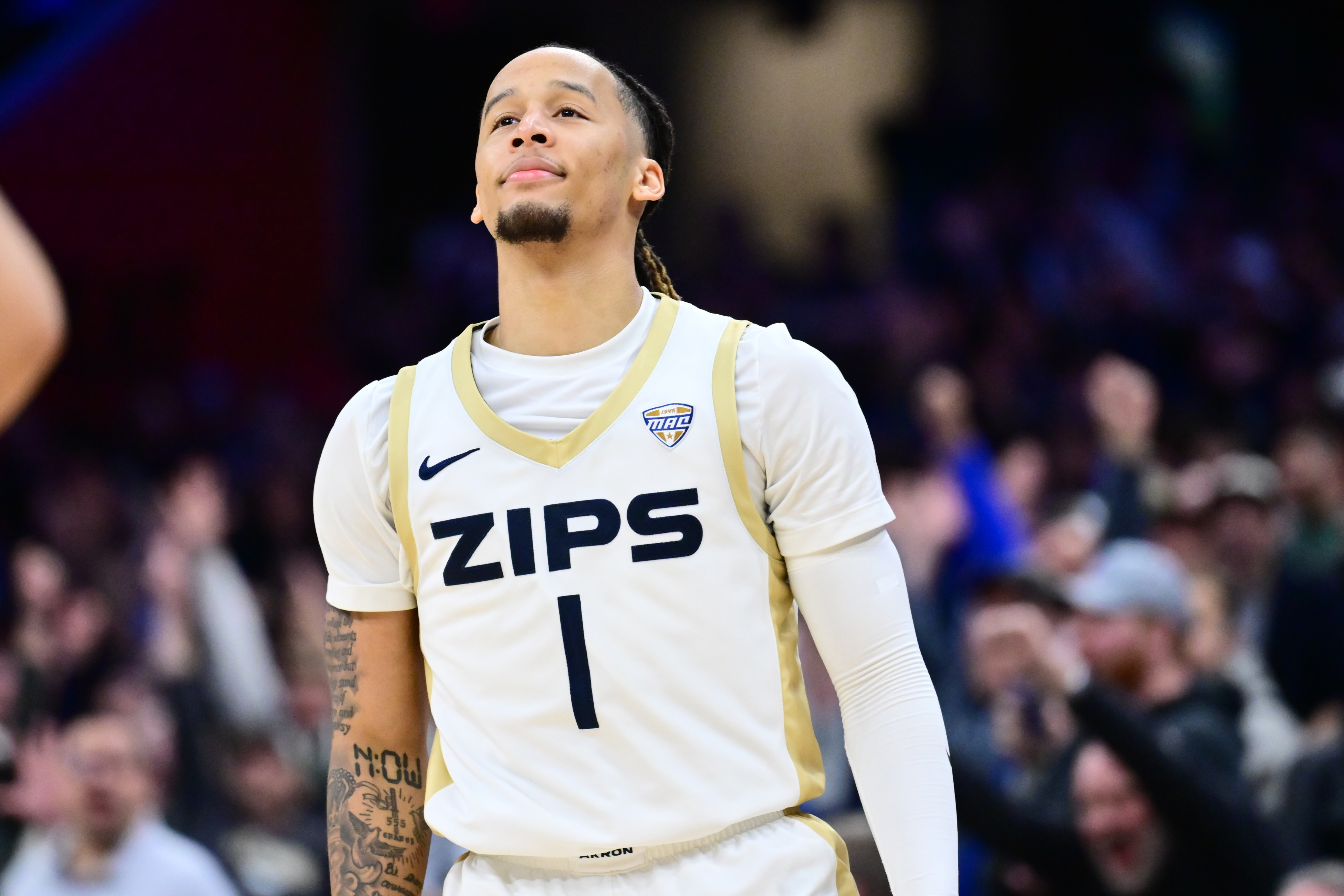 Akron Zips guard Shammah Scott reacts after hitting a 3-pointer as we make our best Akron vs. Texas Tech prediction.