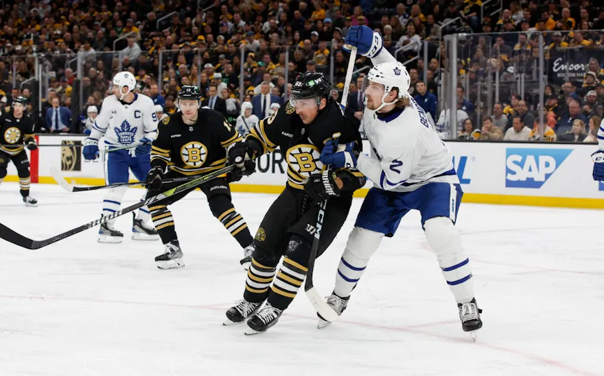 Simon Benoit checks Brad Marchand of the Boston Bruins as we make our expert predictions for Game 5 of the first round series between the Toronto Maple Leafs and Boston Bruins. 