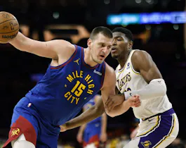 Nikola Jokic spins around Rui Hachimura of the Los Angeles Lakers at Crypto.com Arena. The Nuggets have the second shortest odds to win the NBA Finals.