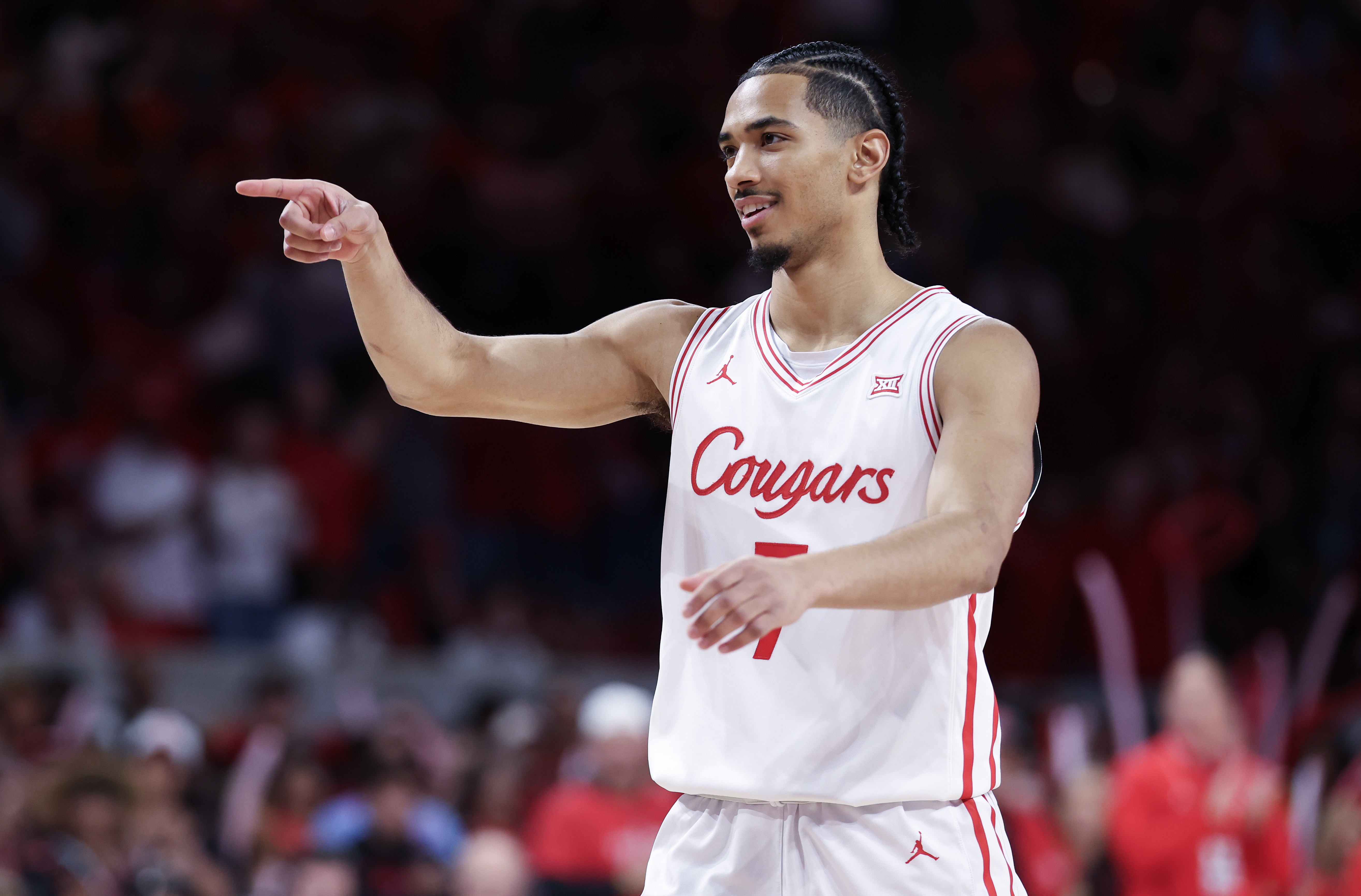 Houston Cougars guard Milos Uzan reacts while playing against the Kansas State Wildcats, and we're backing his team with our Arizona vs. Houston prediction. 