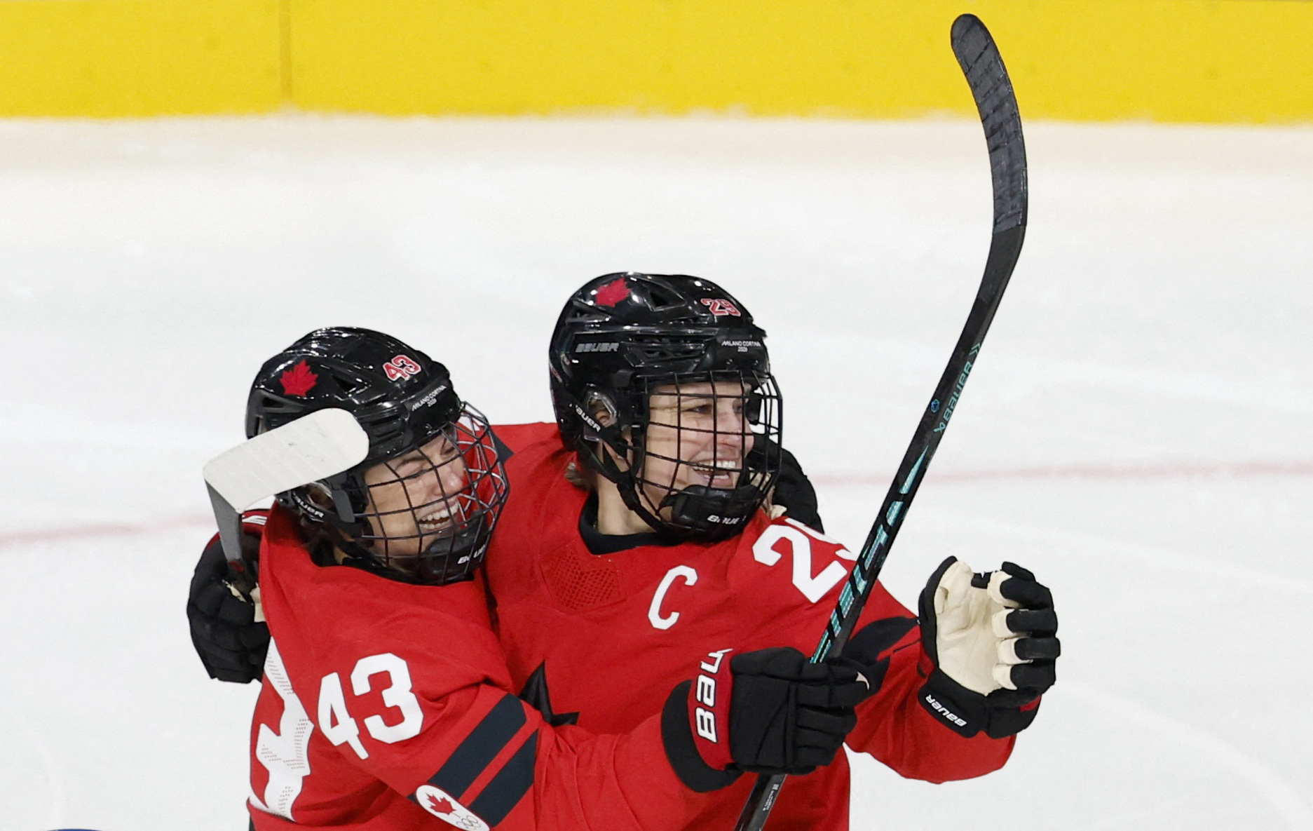 Kristin O'Neill celebrates scoring with Marie-Philip Poulin as we make our best Canada vs. Switzerland predictions. 