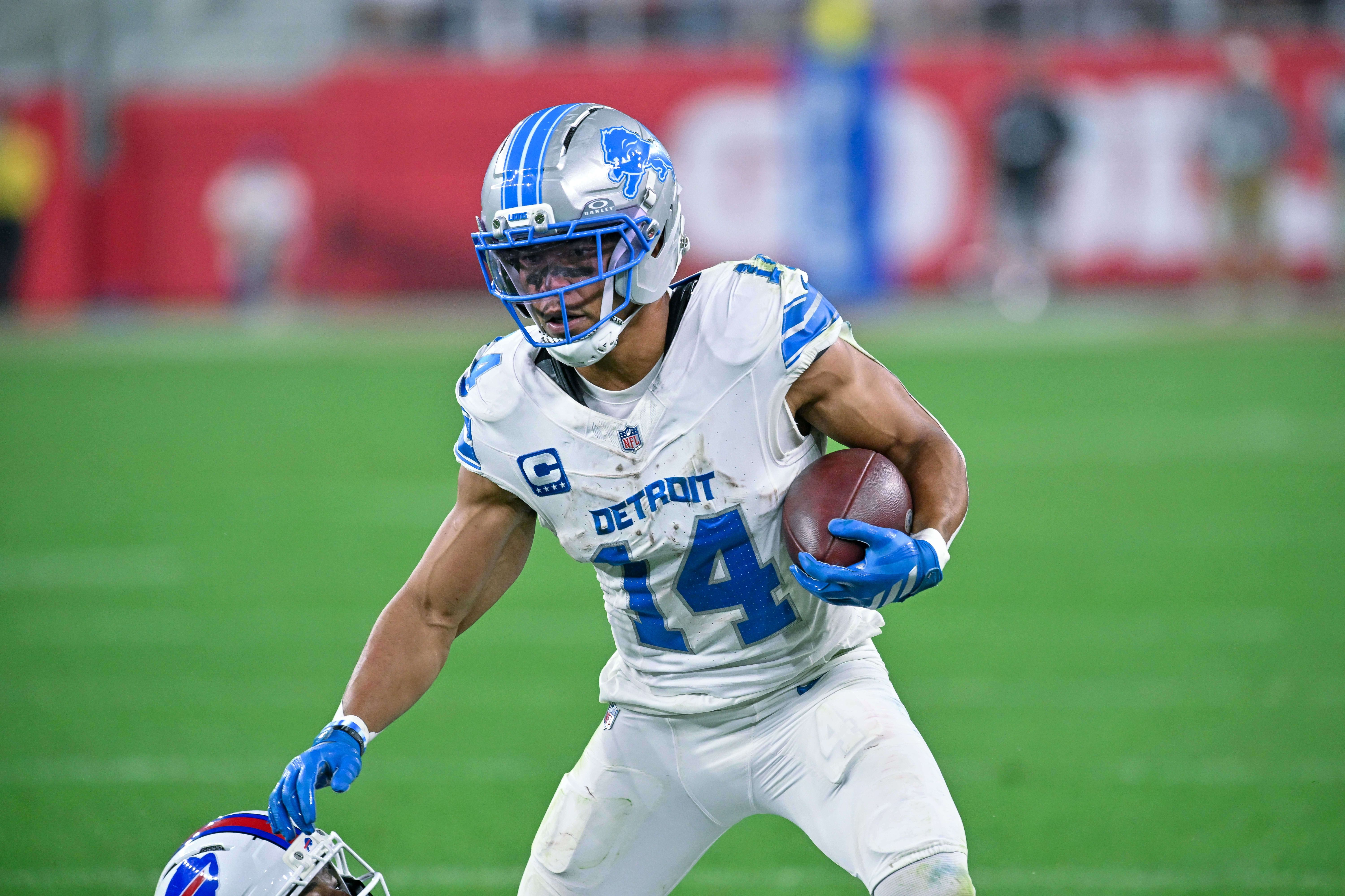 Detroit Lions wide receiver Amon-Ra St. Brown carries the ball as we make our best NFL player props for Week 4.