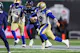 Zach Collaros of the Winnipeg Blue Bombers runs with the ball in the first half of the 109th Grey Cup game between the Toronto Argonauts and Winnipeg Blue Bombers at Mosaic Stadium. We look at the Blue Bombers in our Grey Cup Predictions. 