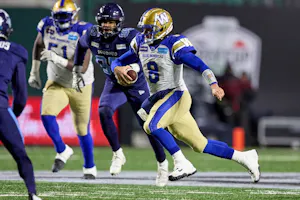 Zach Collaros of the Winnipeg Blue Bombers runs with the ball in the first half of the 109th Grey Cup game between the Toronto Argonauts and Winnipeg Blue Bombers at Mosaic Stadium. We look at the Blue Bombers in our Grey Cup Predictions. 