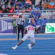 Running back George Holani of the Boise State Broncos hurdles as look at the latest Mountain West conference odds.