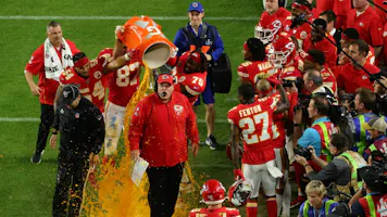Head coach Andy Reid of the Kansas City Chiefs gets dunked in Gatorade after defeating the San Francisco 49ers 31-20 in Super Bowl LIV at Hard Rock Stadium.