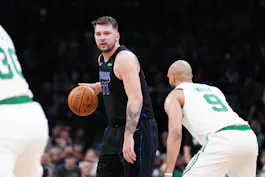 Dallas Mavericks guard Luka Doncic (77) controls the ball as we offer our best Luka Doncic player props and expert picks for Game 2 of the NBA Finals on Sunday at TD Garden in Boston.