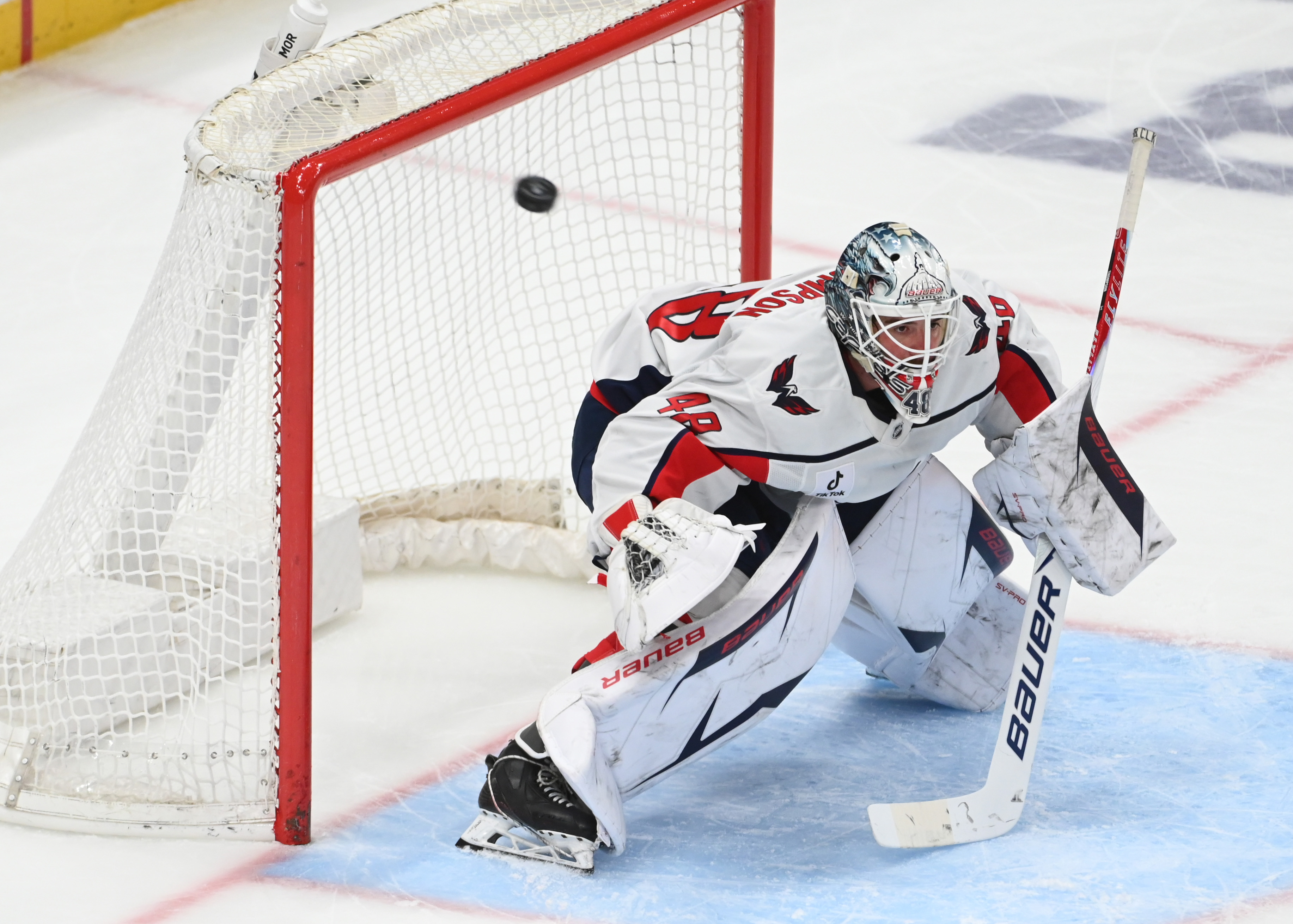 The puck flies over Washington Capitals goalie Logan Thompson (48) as we take a closer look at the 2026 Vezina Trophy odds.