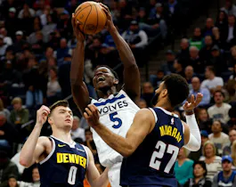 Anthony Edwards (5) of the Minnesota Timberwolves goes up for a shot while Christian Braun (0) and Jamal Murray (27) of the Denver Nuggets, as we offer our best Timberwolves vs. Nuggets player props for Game 1 on Saturday.