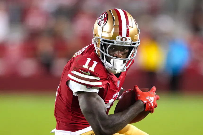 San Francisco 49ers wide receiver Brandon Aiyuk runs after a catch as we offer our best 49ers vs. Seahawks player prop bets for Thursday Night Football.