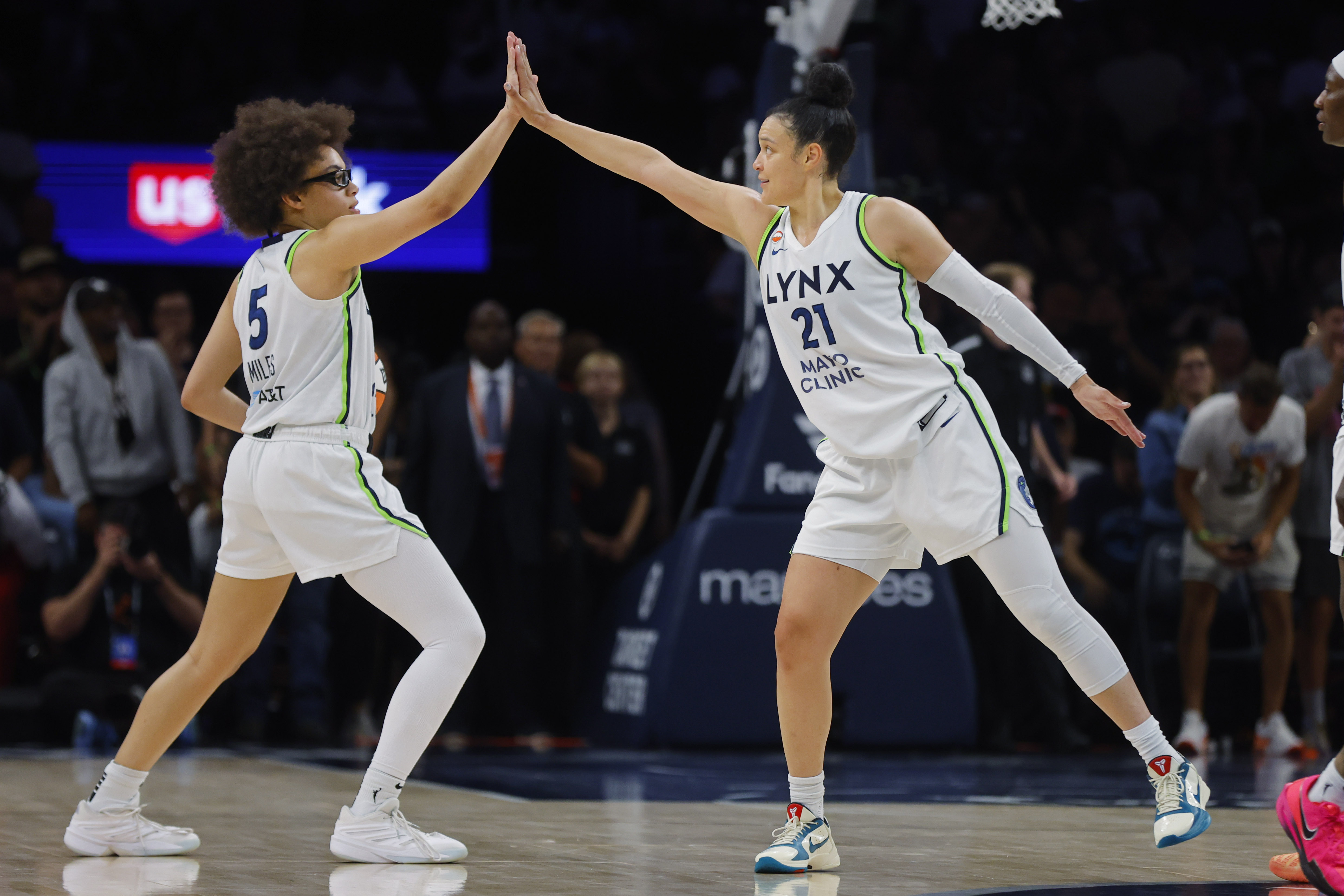 Minnesota Lynx guard Olivia Miles and guard Kayla McBride celebrate as we make our best Lynx vs. Storm prediction.