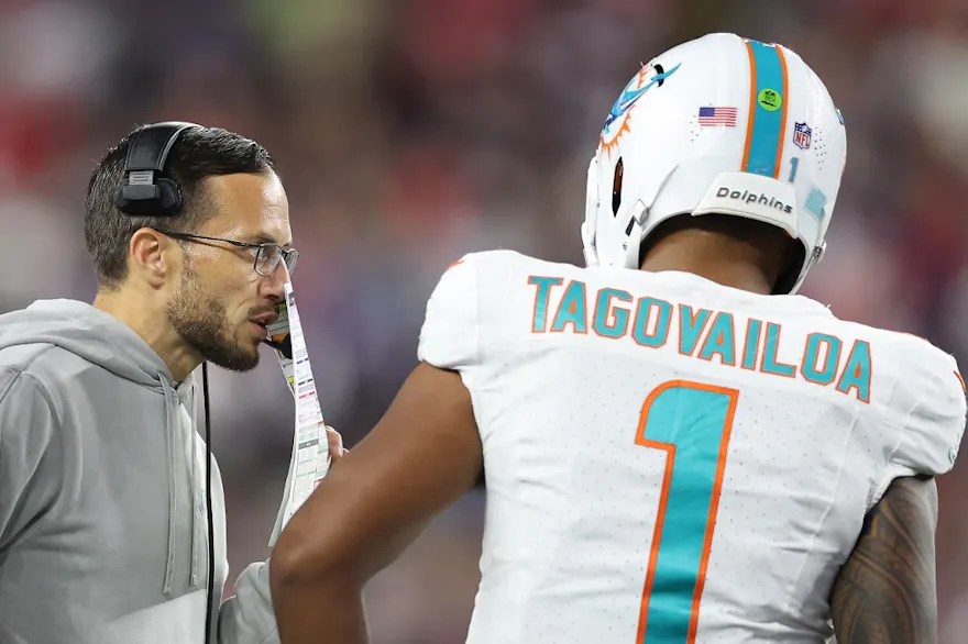 Head coach Mike McDaniel of the Miami Dolphins talks with Tua Tagovailoa as we look at our top Dolphins vs. Chiefs player props.
