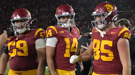 USC Trojans offensive lineman Micah Banuelos (59), quarterback Jayden Maiava (14) and USC Trojans defensive end Jadyn Ramos (95) celebrate as part of our USC vs. Nebraska Player Prop Bets.