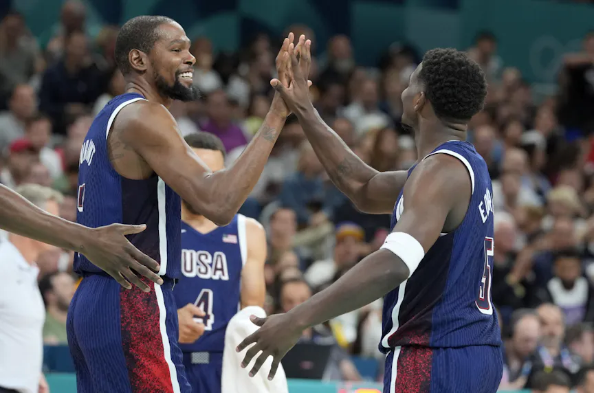 United States guard Kevin Durant (7) and guard Anthony Edwards (5) celebrate as we examine the Olympic men's basketball odds for Paris 2024.