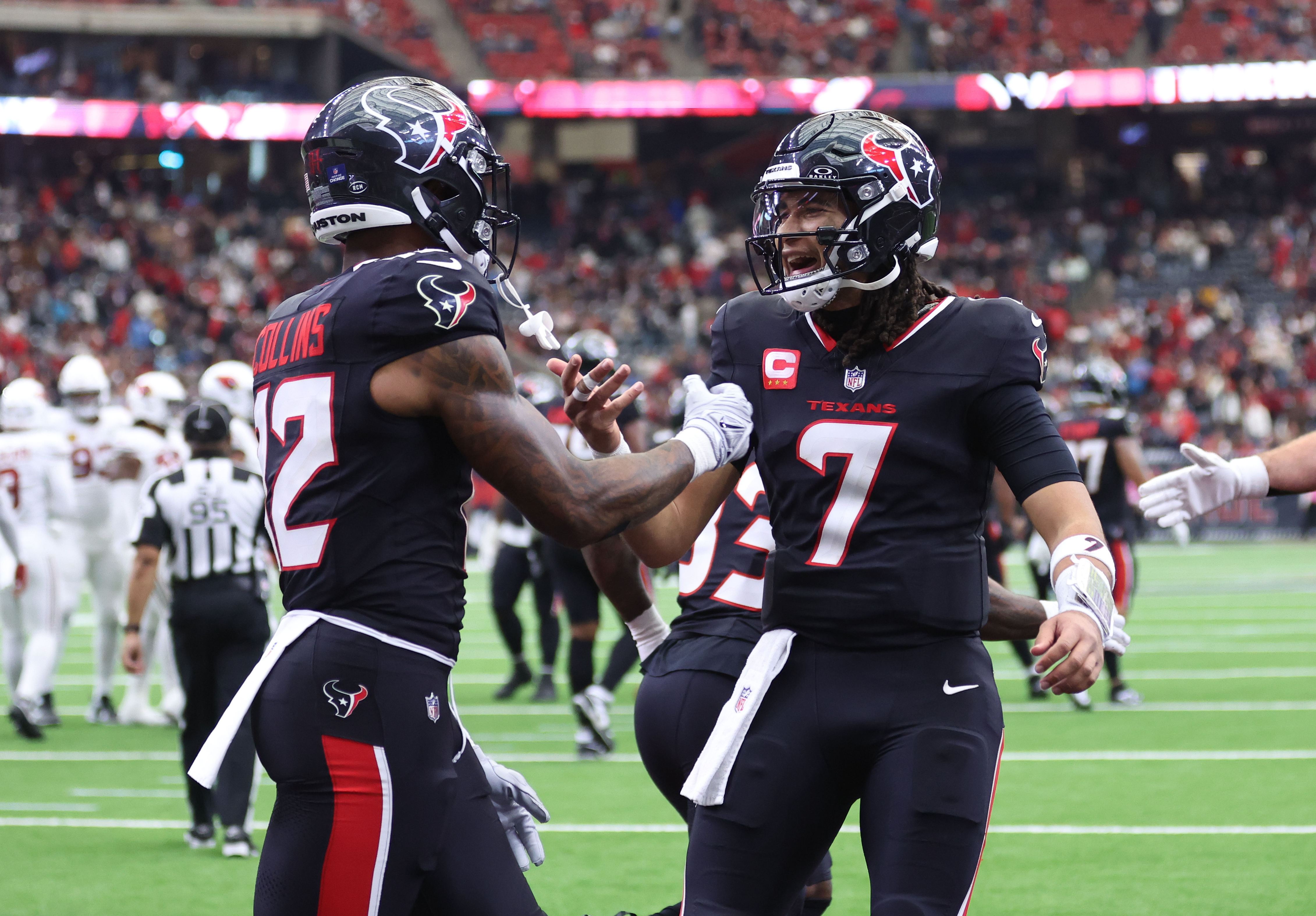 Houston Texans wide receiver Nico Collins (12) and quarterback C.J. Stroud (7) celebrate a touchdown as we break down our Texans vs. Steelers AI picks for NFL Wild Card Weekend.