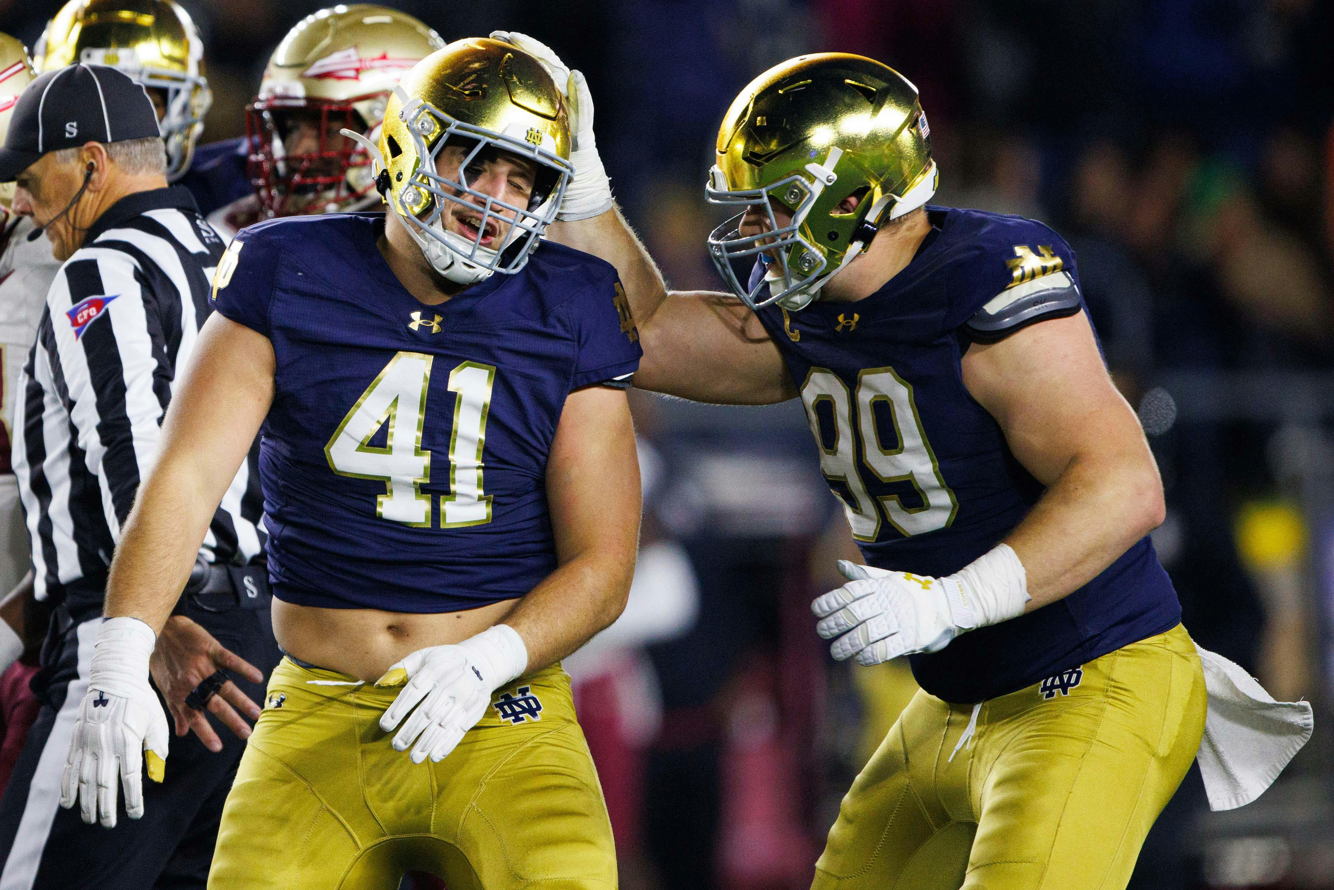 Notre Dame defensive lineman Rylie Mills and defensive lineman Donovan Hinish celebrate getting a stop as we offer our Notre Dame football preview.