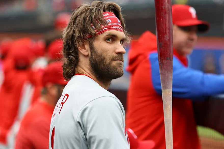 Philadelphia Phillies Bryce Harper stands in the hole during the first inning of a baseball game against the New York Mets as we look at our DraftKings promo code for Marlins-Phillies.