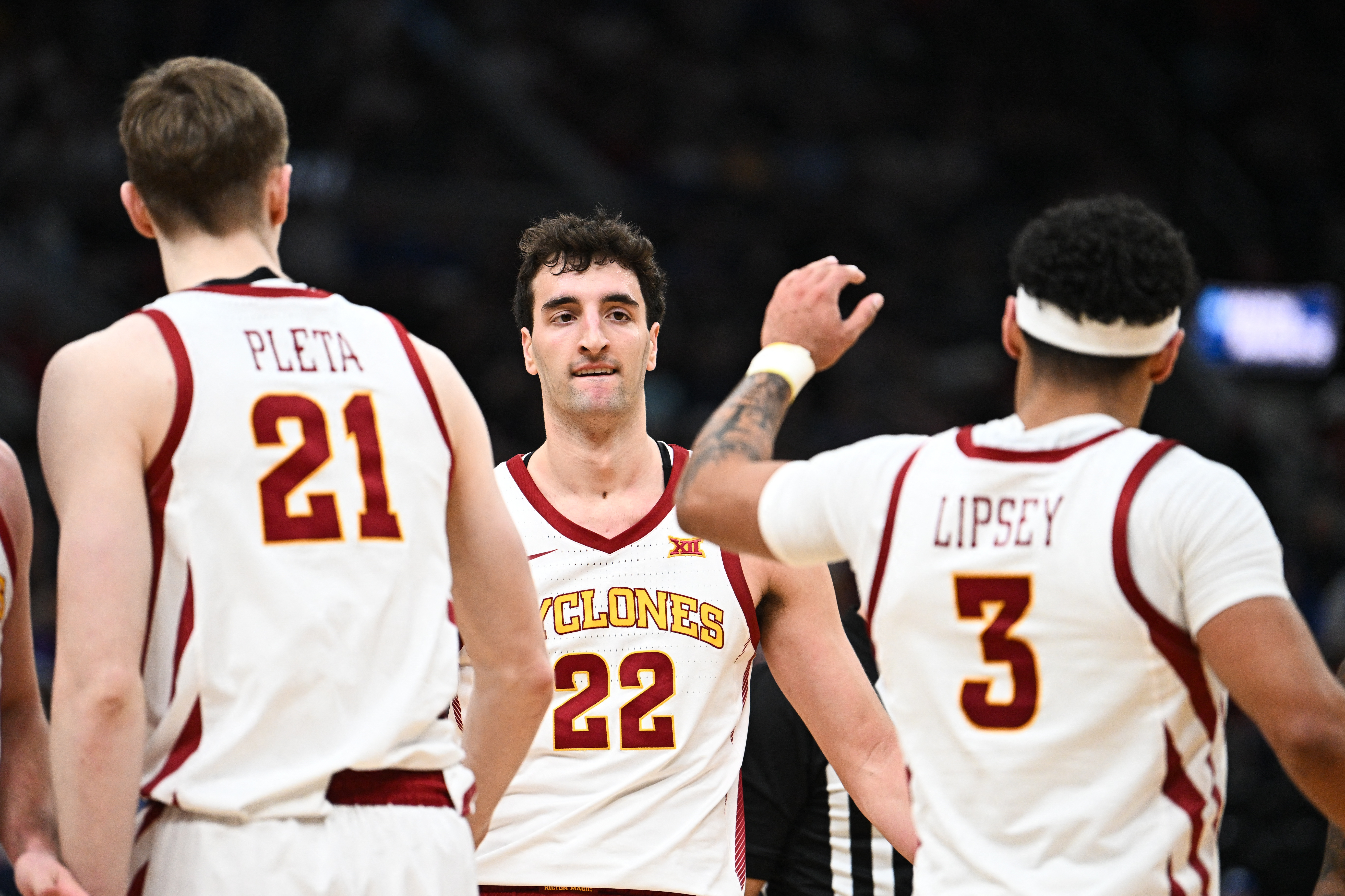 Iowa State Cyclones forward Milan Momcilovic (22), featured in our best March Madness prop bets, celebrates with guard Tamin Lipsey (3).