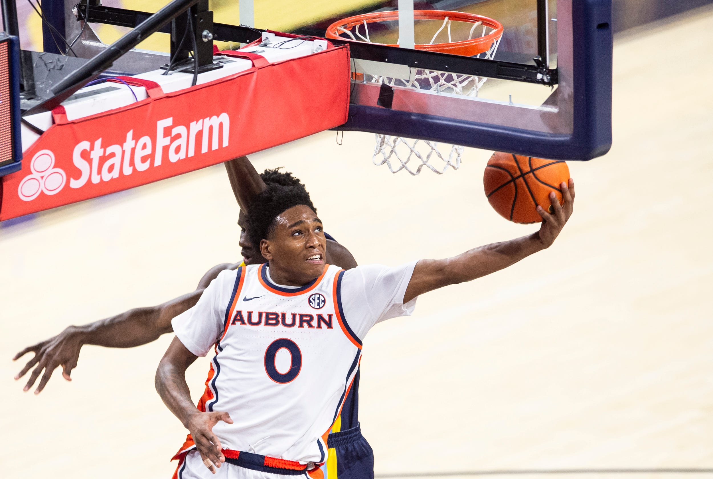 uburn guard Tahaad Pettiford goes up for a layup as we provide our Houston vs. Auburn prediction