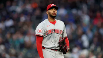 Hunter Greene of the Cincinnati Reds looks on during the game against the Seattle Mariners, and we offer our top MLB player props and expert picks based on the best MLB odds.