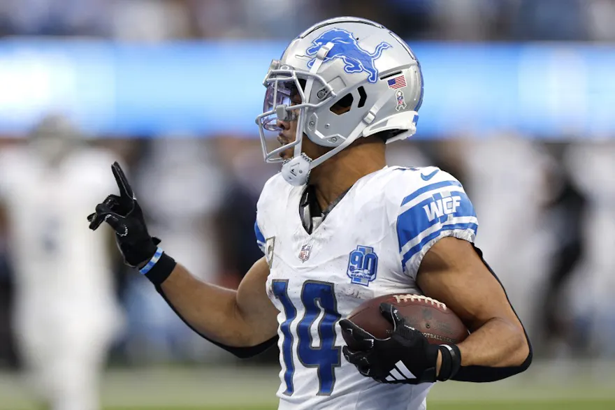 Amon-Ra St. Brown #14 of the Detroit Lions reacts as we offer our top receiving prop predictions for Week 11 based on the best NFL odds.