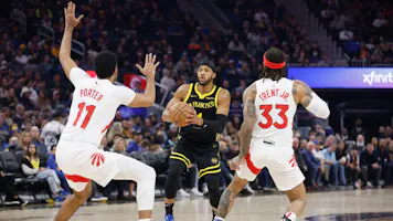 Moses Moody #4 of the Golden State Warriors looks to shoot the ball against Jontay Porter as we look at updates around possible punishments for Porter in a gambling scandal.
