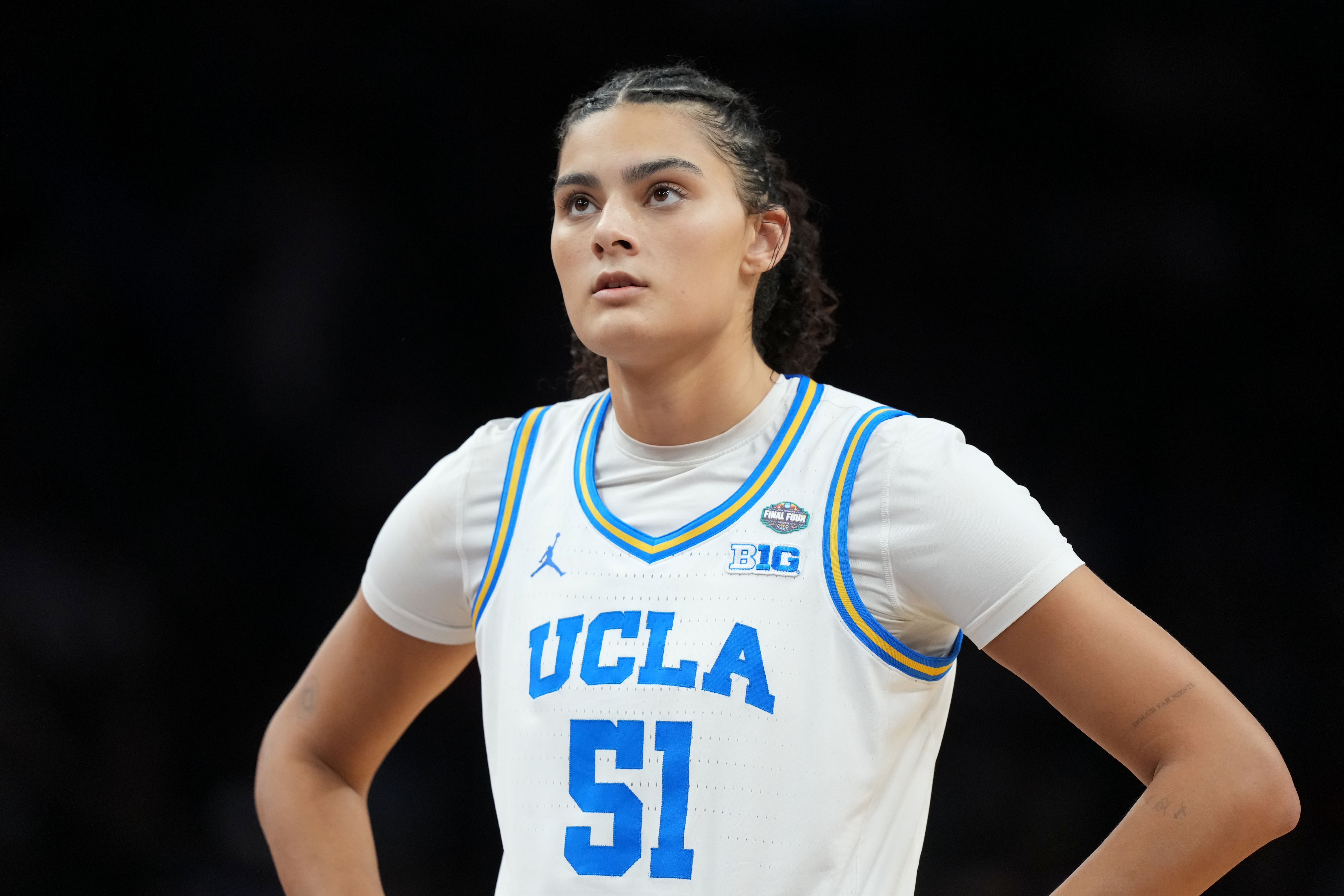 UCLA Bruins center Lauren Betts (51), seen here looking on during a game, is featured in our South Carolina vs. UCLA prediction today.