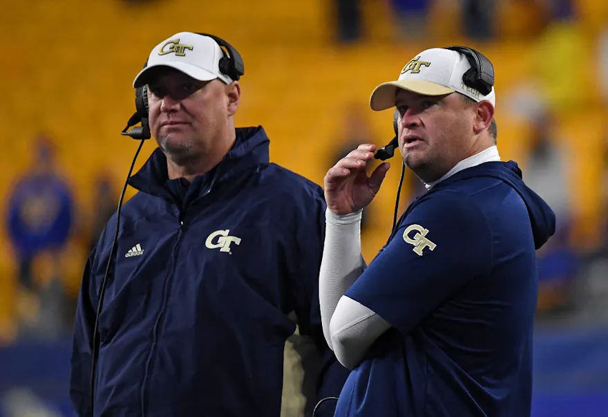 Head coach Brent Key of the Georgia Tech Yellow Jackets (right) looks on as we share the best Louisville vs. Georgia Tech promo code.