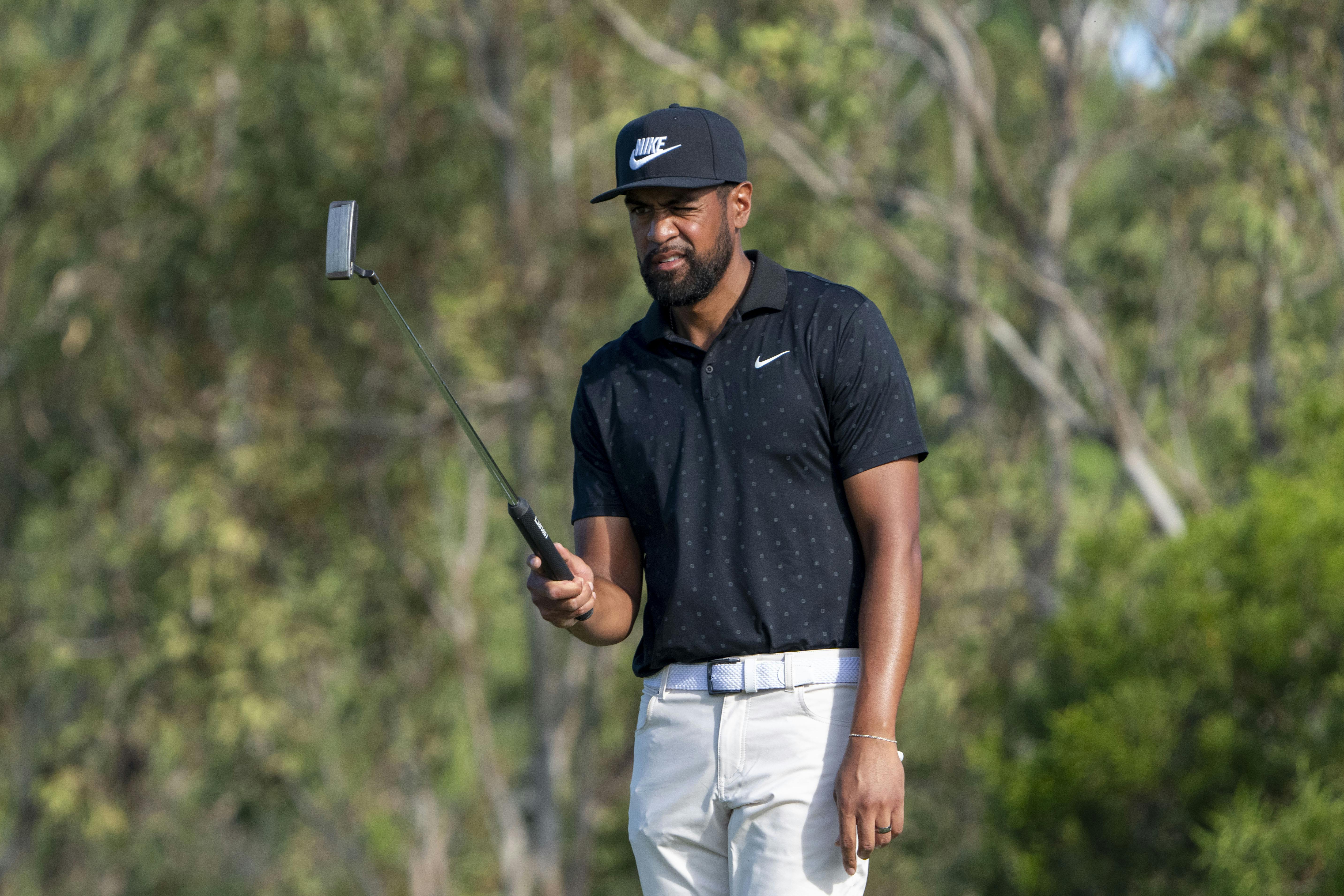 Tony Finau lines up his putt as we make our Farmers Insurance Open picks.