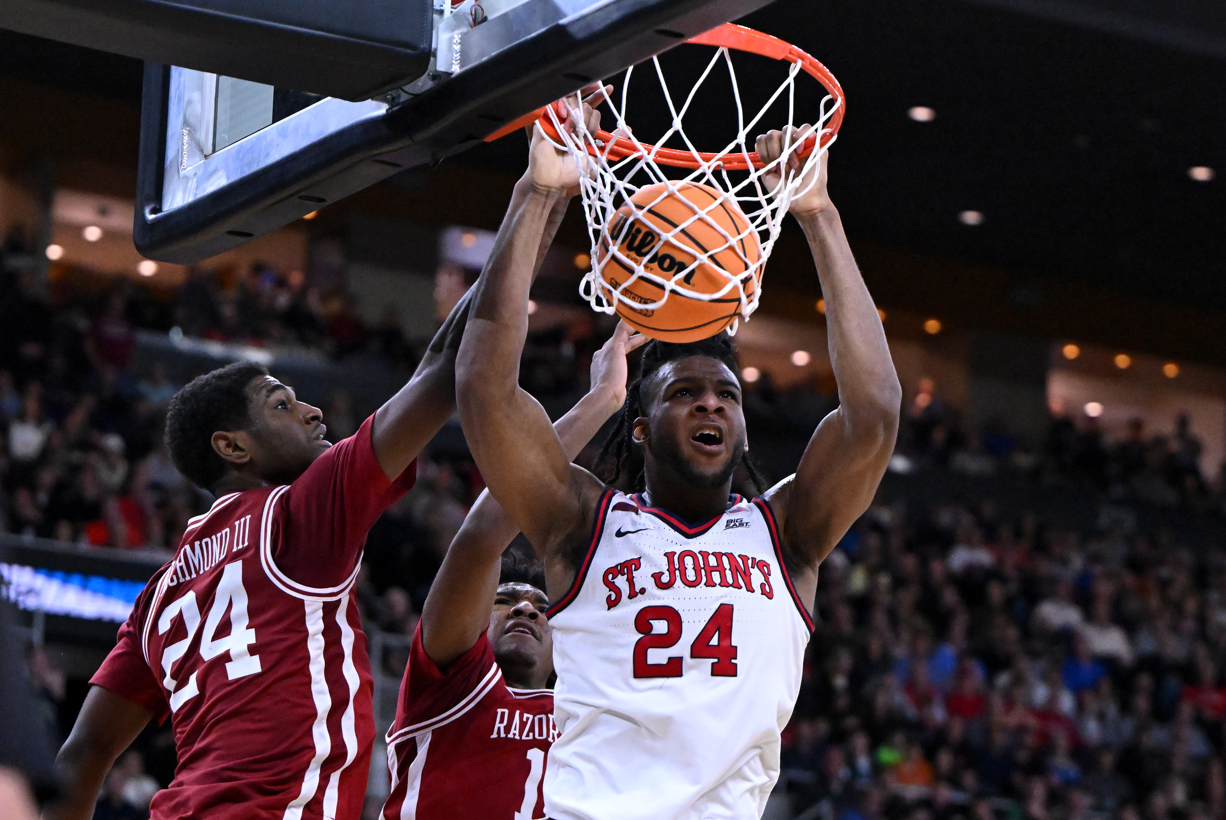 St. John's forward Zuby Ejiofor (24) dunks as we offer our college basketball best bets today
