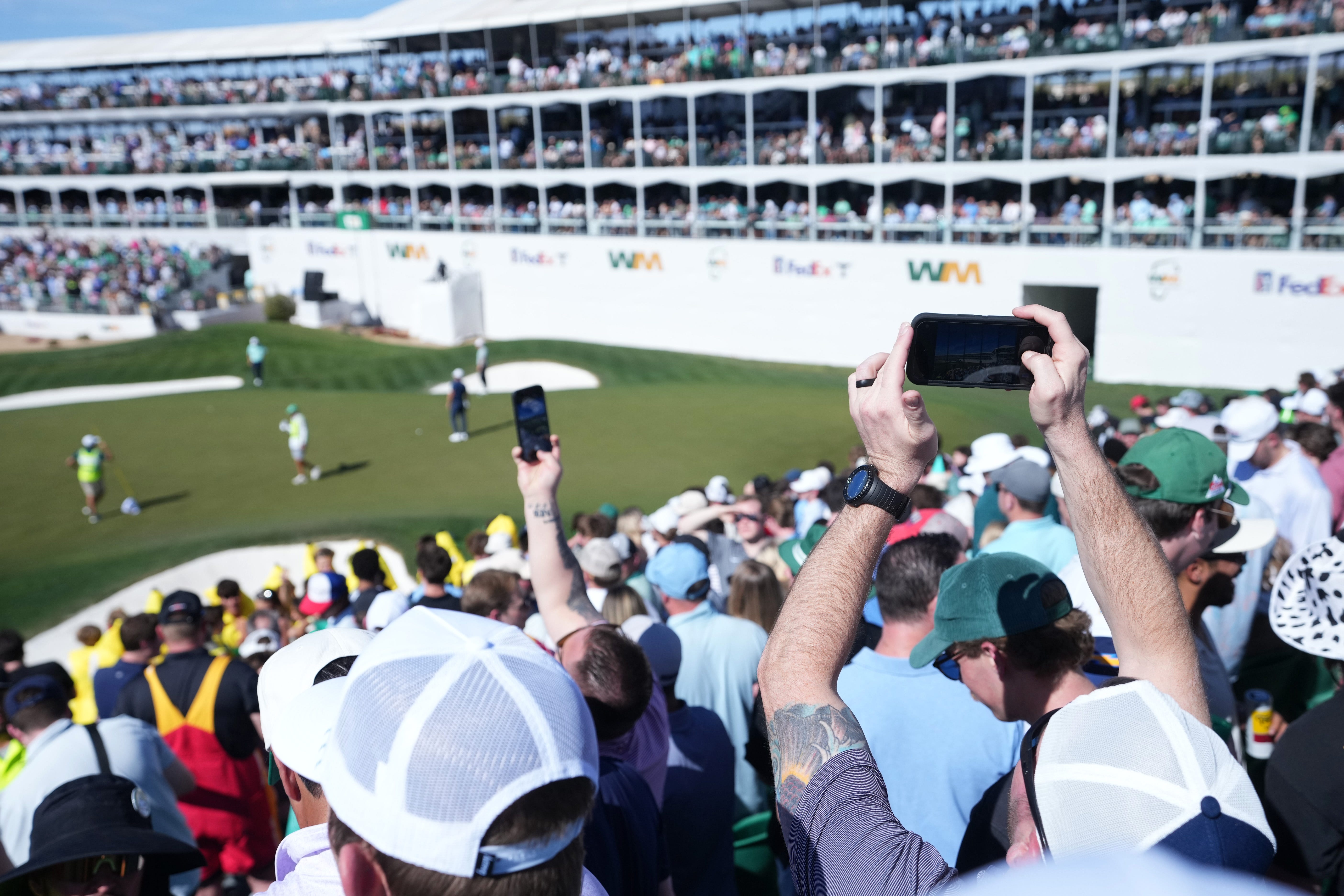 Fans watch golfers on the 16th hole of the Phoenix Open at TPC Scottsdale as we look at the WM Phoenix Open odds from DraftKings