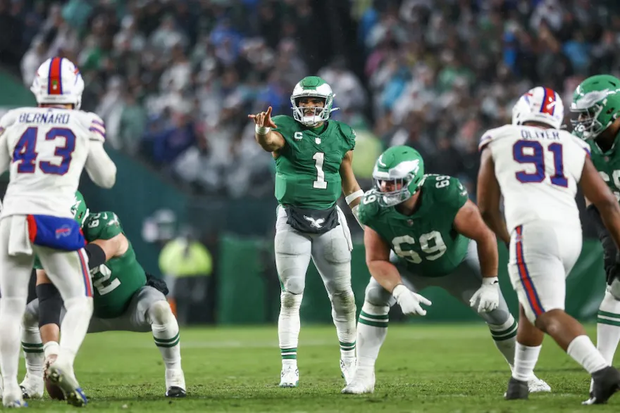 Jalen Hurts of the Philadelphia Eagles calls a play as part of our Week 13 NFL predictions for 49ers vs. Eagles