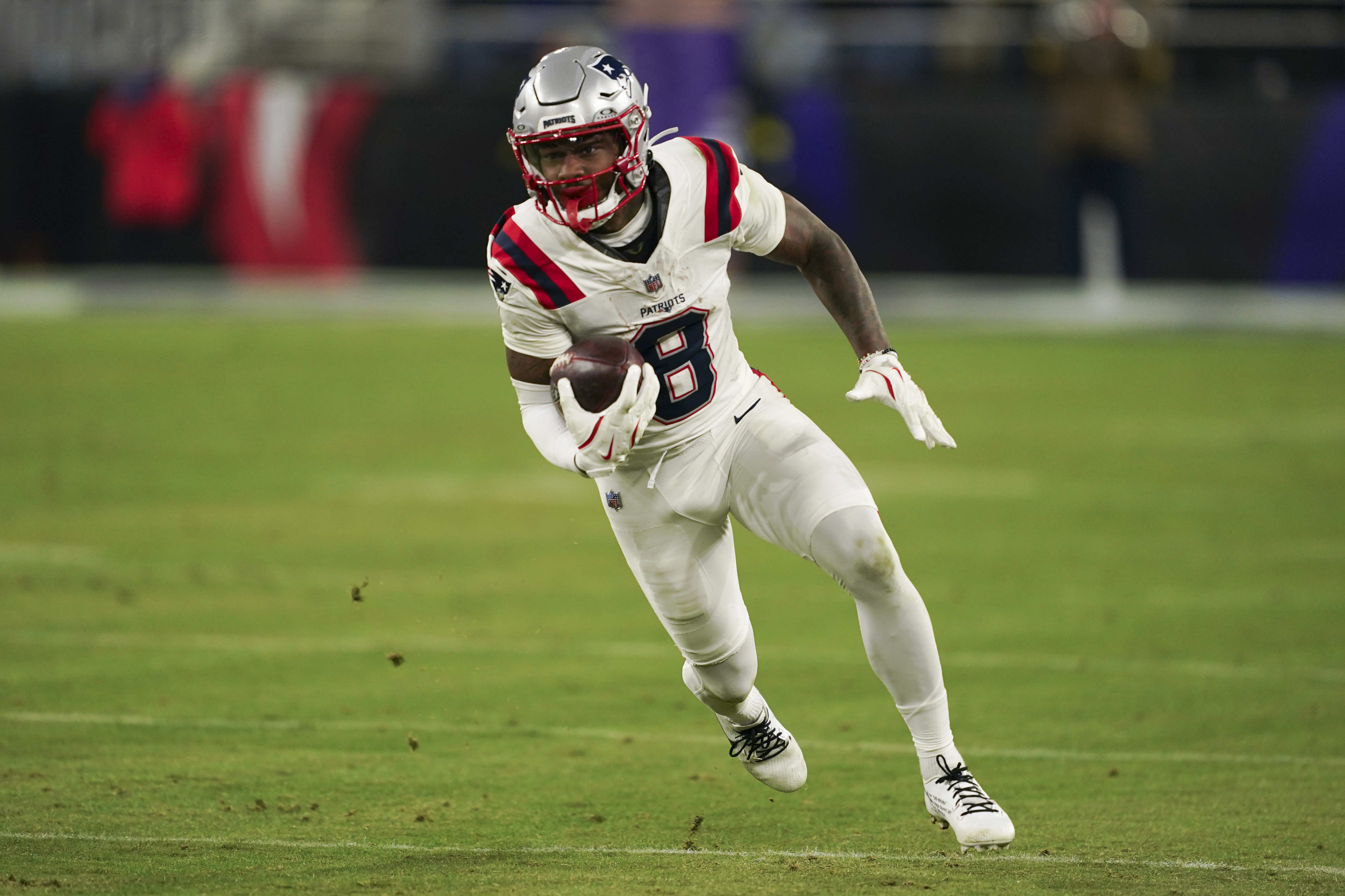New England Patriots wide receiver Stefon Diggs (8) runs the ball as he is featured in our NFL anytime touchdown scorer predictions.