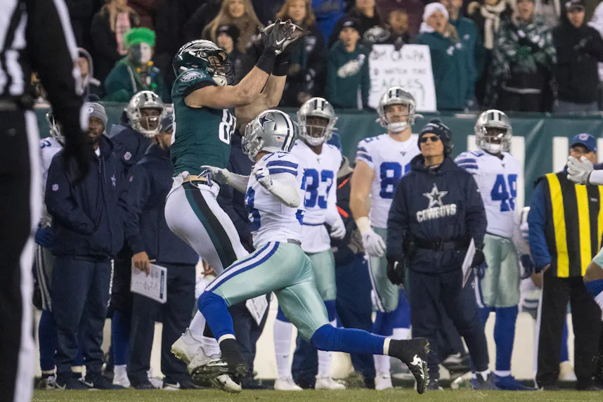Eagles' Dallas Goedert (88) makes a reception over top of a Cowboys defender as we make our best anytime touchdown scorer predictions for Thursday Night Football.