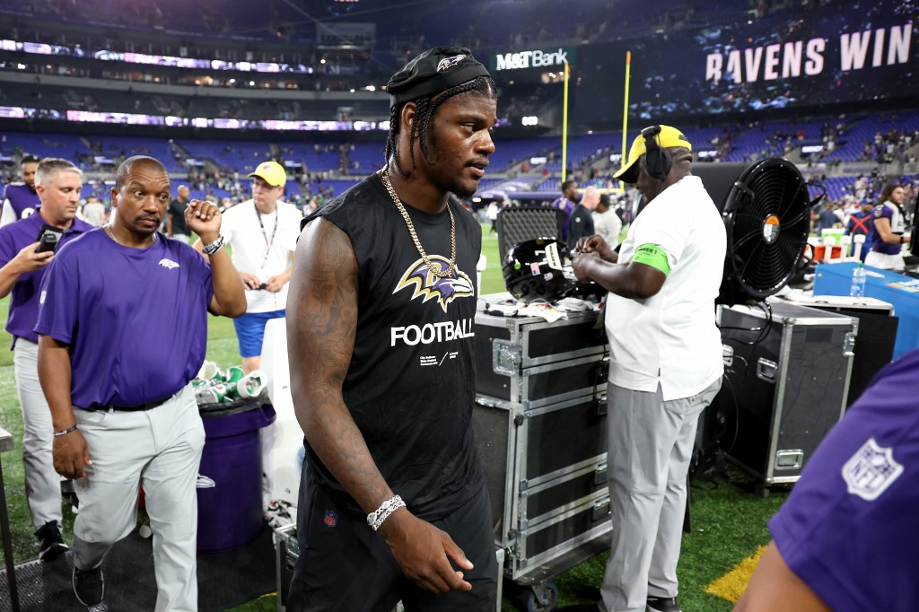 Quarterback Lamar Jackson of the Baltimore Ravens walks off the field following the Ravens and Philadelphia Eagles preseason game at M&T Bank Stadium, and we offer new U.S. bettors our exclusive BetRivers promo code for Ravens vs. Commanders.