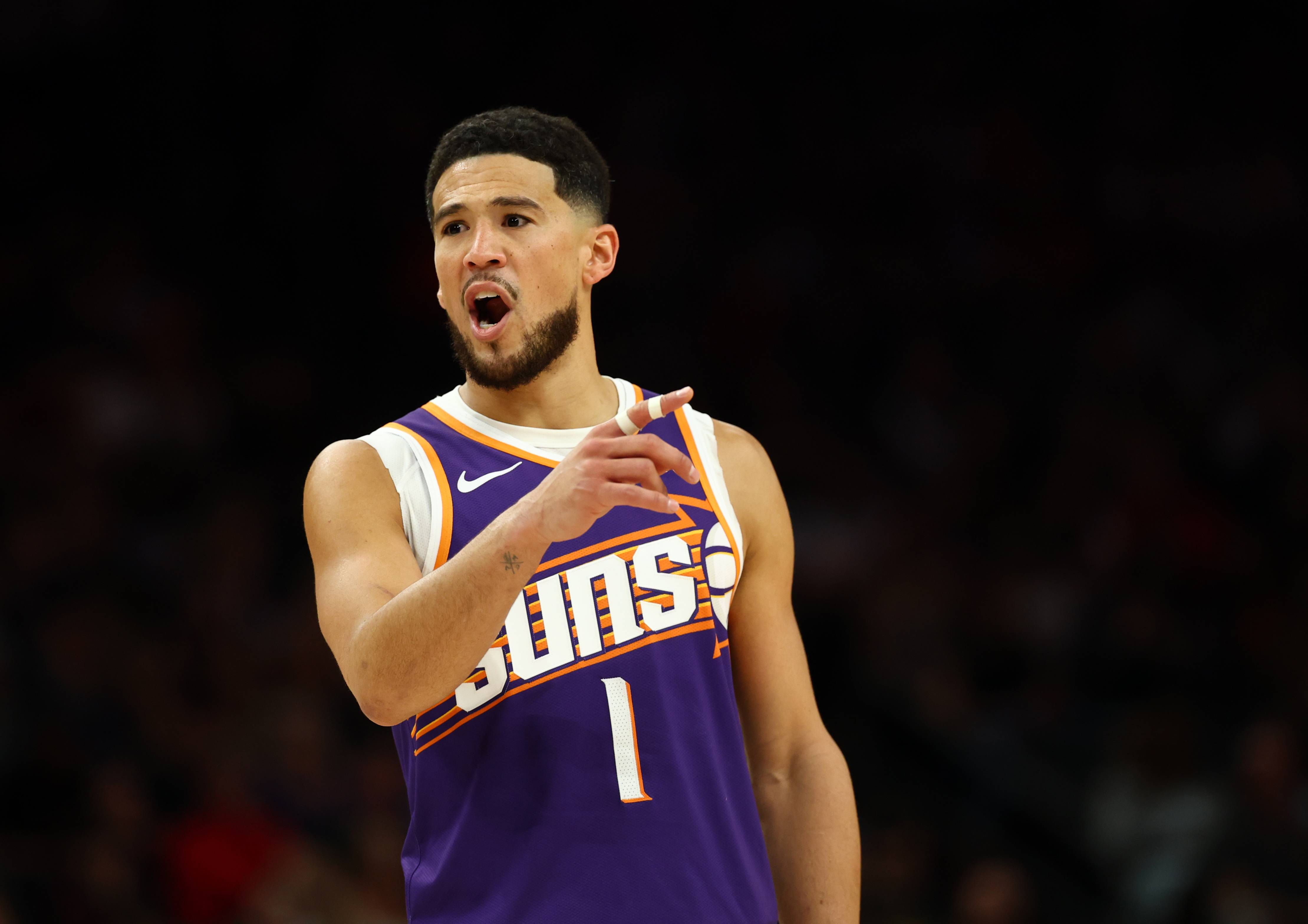 Phoenix Suns guard Devin Booker (1), seen here reacting during a game, is featured in our Trail Blazers vs. Suns prediction.