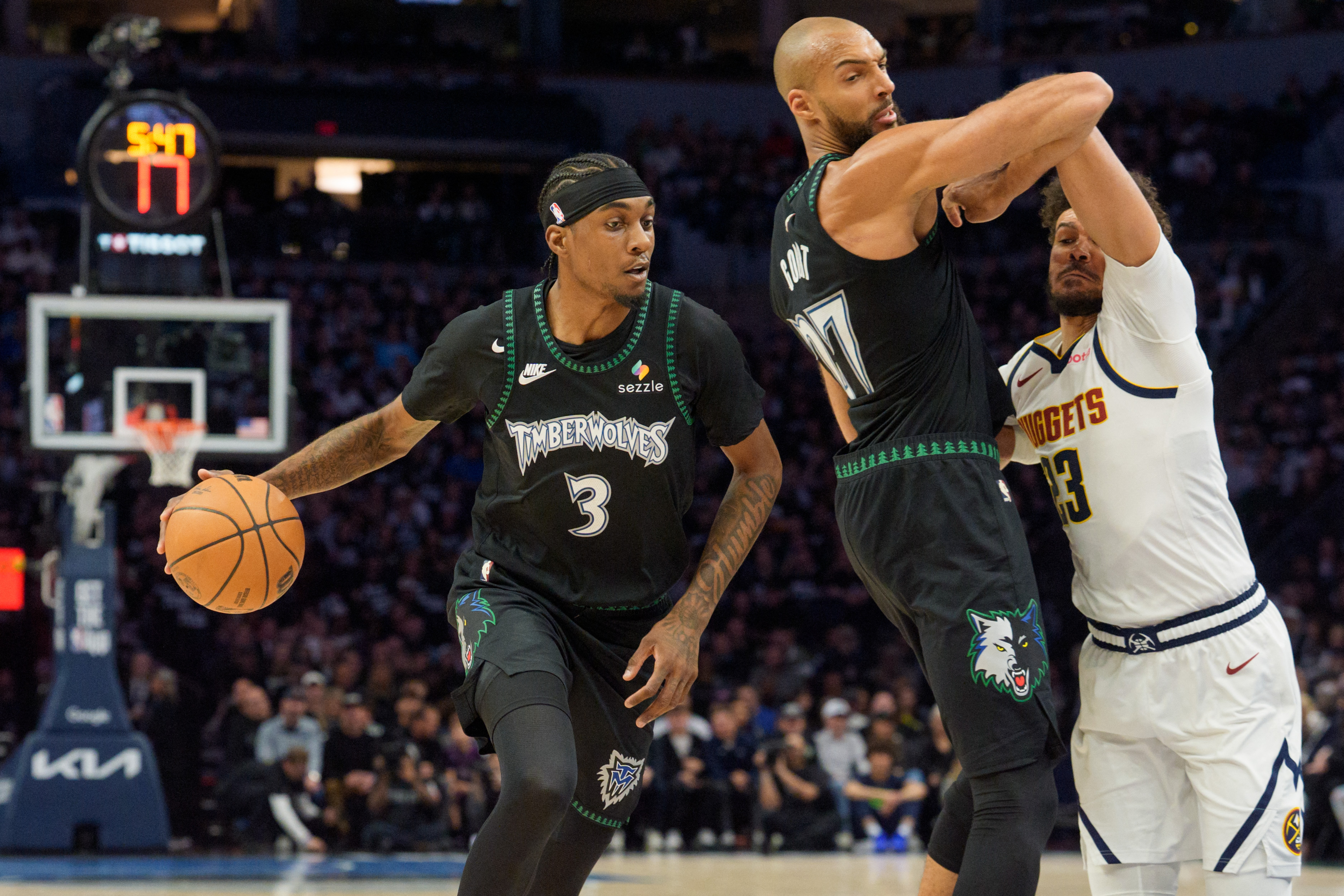 Minnesota Timberwolves forward Jaden McDaniels (3) drives as center Rudy Gobert (27) sets a screen, and both are featured in our NBA player props today.