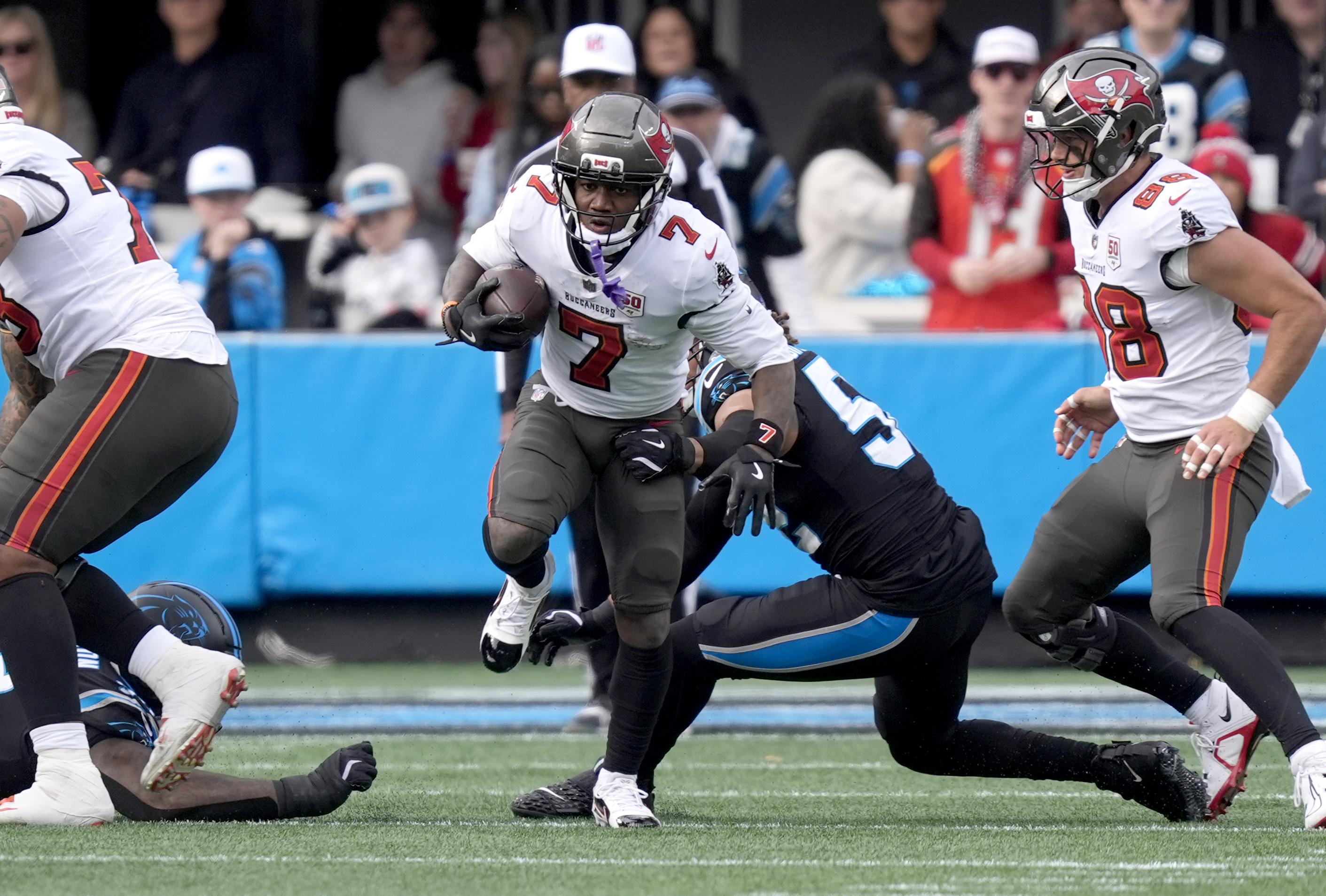 Bucky Irving in action as we offer our NFL anytime touchdown scorer predictions. 