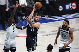 Luka Doncic of the Dallas Mavericks is defended by Anthony Edwards of the Minnesota Timberwolves during Game 4 of the Western Conference Finals. We're breaking down the Luka Doncic Odds ahead of Game 5. 