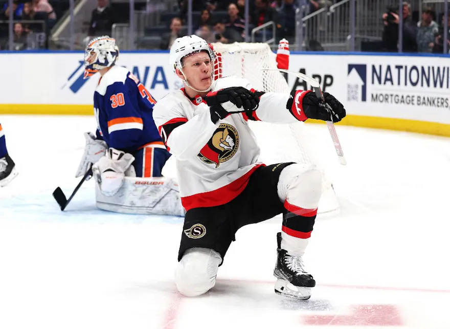 Brady Tkachuk #7 of the Ottawa Senators scores a goal in the third period against Ilya Sorokin #30 of the New York Islanders on Feb. 14. Target Tkachuk in our NHL shot prop parlay. 