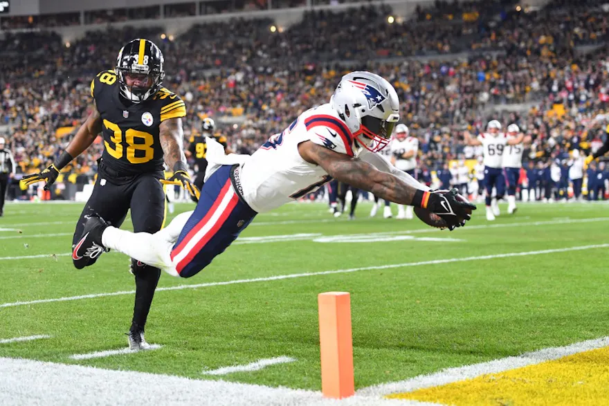 Running back Ezekiel Elliott of the New England Patriots dives for a touchdown against the Pittsburgh Steelers.
