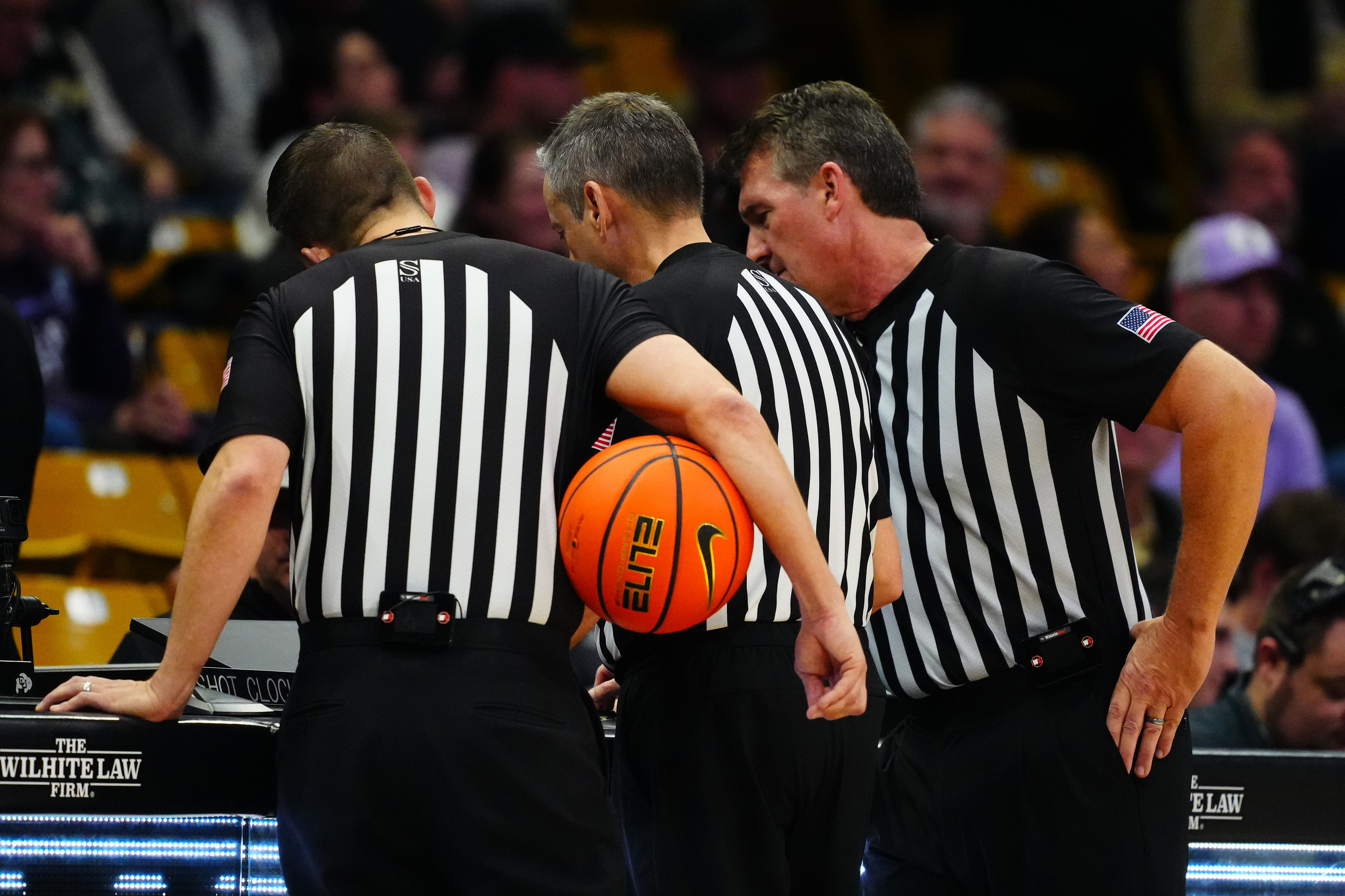 Members of the NCAA referees review a foul as we look at the NCAA partnership with IC360 for integrity monitoring.