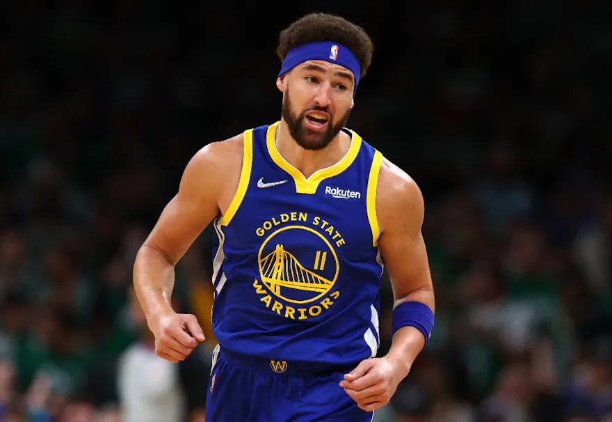 Klay Thompson of the Golden State Warriors celebrates a 3-pointer against the Boston Celtics during the first quarter in Game 6 of the 2022 NBA Finals.