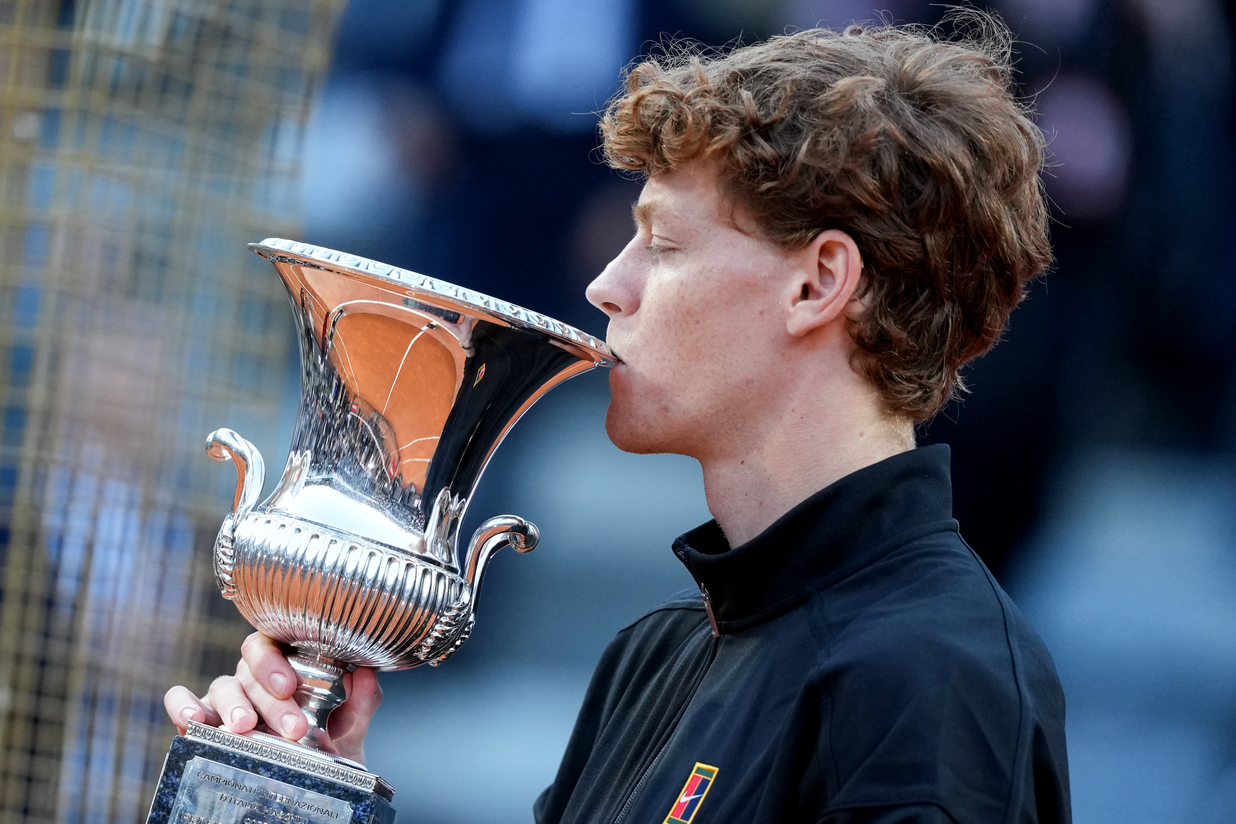 Jannik Sinner - who's featured in my Wimbledon predictions - of Italy Kisses the Trophy.