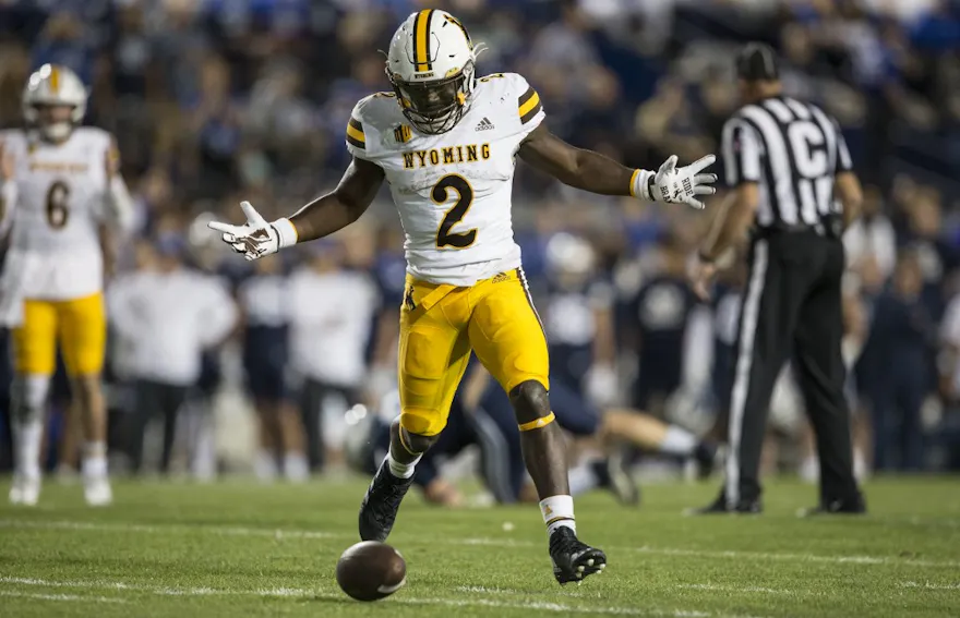 Titus Swen of the Wyoming Cowboys drops a pass from Andre Peasley during the first half of their game against the Brigham Young Cougars.