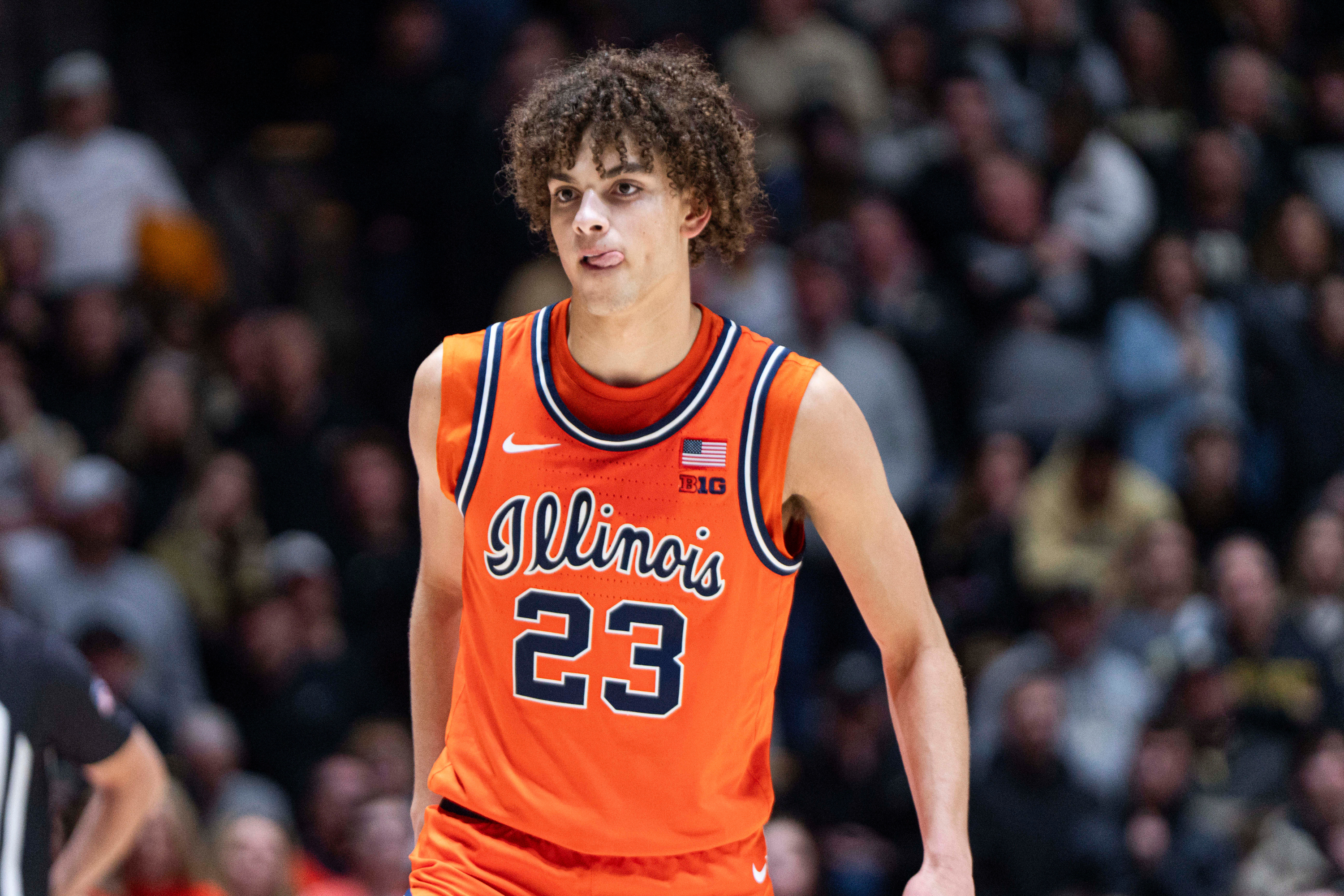 Illinois Fighting Illini guard Keaton Wagler (23), seen here looking on during a game, is featured in our Illinois vs. UConn prediction tonight.